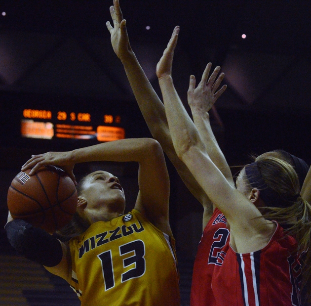 Missouri senior forward Bri Kulas (13) attempts a shot against two Ole Miss defenders. Kulis led all scorers with 26 points in the game.