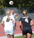 Missouri’s Lauren Flynn (11, hidden) throws the ball in to teammate Reagan Russell (6), as Vanderbilt’s Taylor Richardson guards Russell closely. Flynn and the Missouri defense allowed 5 shots on goal by the Commodores.