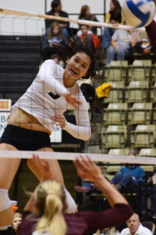 Outside hitter Carly Kan jumps to kill a ball in the fourth set. Kan had a team-high of 12 kills with a .195 hitting percentage in the match.