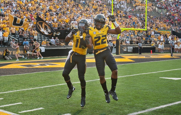 Missouri's Aarion Penton, left, celebrates with teammate Anthony Sherrils after Penton scored a touchdown during the third quarter of Saturday's game against Southeast Missouri State. (AP Photo/L.G. Patterson)